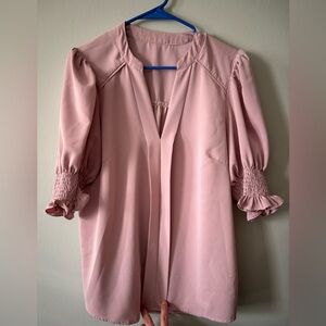 Large pink v-neck blouse with puff ruffle sleeves